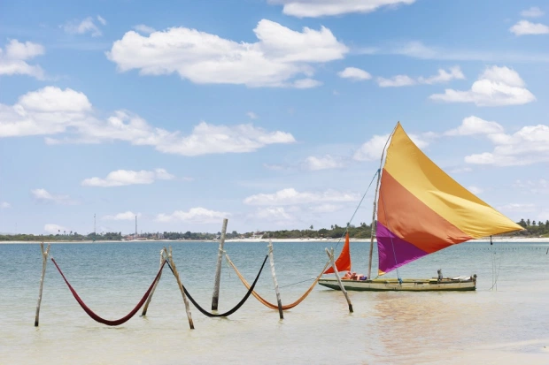 beautiful sail boat and hammocks at the Paradise Lake (Jericoacoara, Brazil)
